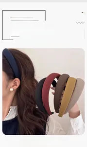 Detail showing the thick sponge padded headbands in various elegant solid colors