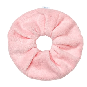 Pink plush oversized hair scrunchie in soft coral fleece for elegant buns and hair styling