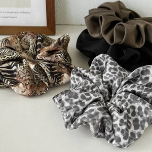 Set of four oversized leopard print and satin scrunchies for voluminous hairstyles