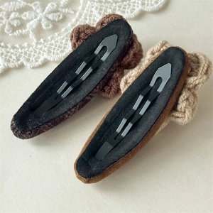 Handmade knitted flower hair clips for women in brown and caramel tones, pair of two