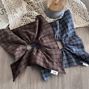 Vintage checkered oversized scrunchies in coffee and blue tones with stylish star-fold design