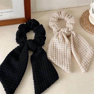 Handmade crochet bow hair scrunchie set in black and beige with waffle texture fabric