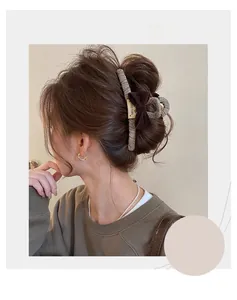 Detail of tweed hair claw clip with brown velvet bow shown in a half-up hairstyle