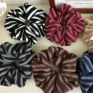 Set of six colorful striped knit scrunchies for women, cozy winter hair accessories pack