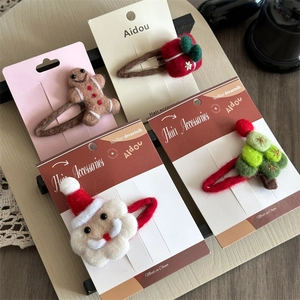 Set of 4 wool felt Christmas hair clips featuring Santa, tree, gift, and gingerbread man