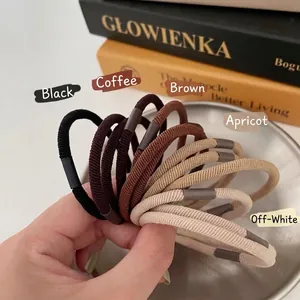 Set di cinque elastici per capelli a costine in nero, caffè, marrone, albicocca e crema