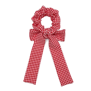 Red and white gingham bow scrunchie with long ribbon tails for ponytail hair styling