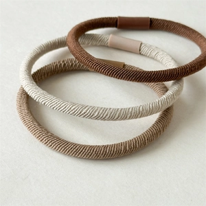 Set di 3 elastici per capelli intrecciati ad alta elasticità nei toni marrone e kaki