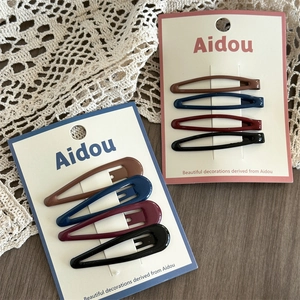 Set of four vintage water-drop snap clips in dark colors on elegant lace and wood