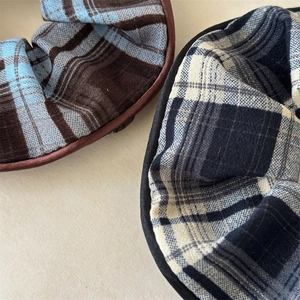 Detail shot showing the textured plaid fabric and premium edge stitching of oversized scrunchies