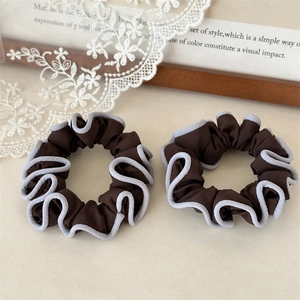 Elegant set of two coffee brown scrunchies with light blue pleated edges in fabric