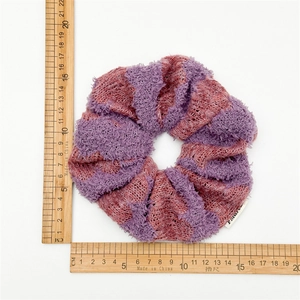 Plush knitted striped scrunchie in purple and dusty pink colors for women hair styling