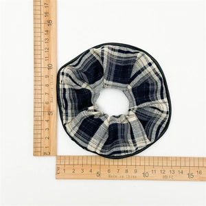 Checkered oversized scrunchie with black edge trim and 11cm diameter measurement view