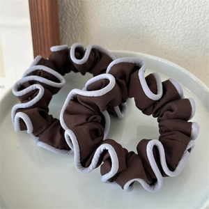 Elegant set of two coffee brown fabric scrunchies with light blue ruffled edge detailing