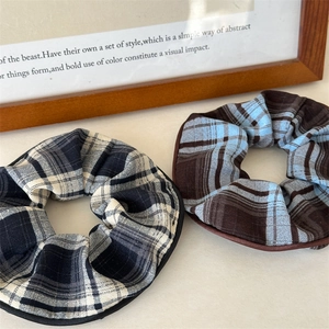 Elegant plaid scrunchies in classic black-white and vintage brown-blue patterns