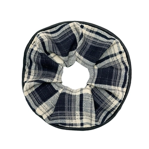 Classic black and white checkered scrunchie with faux leather edges for ponytail hair styling