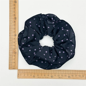 Large black satin scrunchie with purple dots, shown with a ruler for 15cm size reference