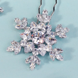 Macro shot of silver snowflake hair pin featuring high-grade zirconia in a claw setting