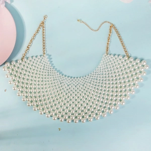 Macro detail of hand-woven mesh pearl choker necklace with gold adjustable lobster clasp