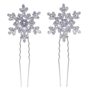 Pair of silver snowflake hair pins with sparkling zircon crystals for bridal hairstyles