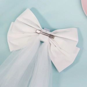White double layer bridal bow veil with pearls and bride lettering for wedding photography