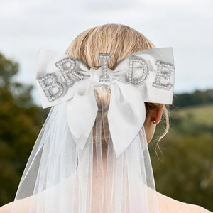 Double-layer white bridal veil with satin bow and pearl BRIDE lettering detail
