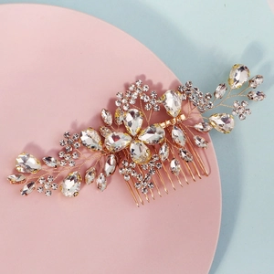 Detail of bridal hair comb featuring golden wires and sparkling clear rhinestones
