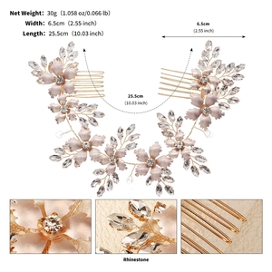 Detail of pink floral bridal hair comb with rhinestones and gold wire weaving