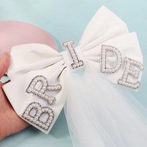 Short double-layer white bridal veil with pearl BRIDE lettering and satin bow