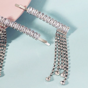 Close-up of sparkling silver rhinestone tassel hairpins with dangling crystal fringe