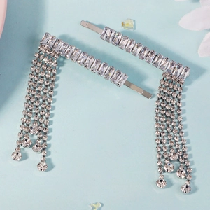 Detail of silver alloy hair clips featuring long rhinestone tassels and zircon inlay