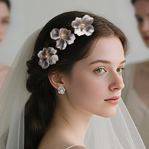 Elegant fabric flower hair pins set with pearls for bridal hairstyles and weddings