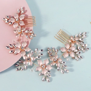 Handmade rose gold bridal hair combs with crystal floral patterns and metallic leaves
