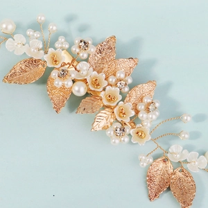 Handmade bridal hair clip with gold leaves, white resin flowers and faux pearls