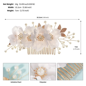 Detailed views of handmade bridal hair comb with pearls and white fabric flowers