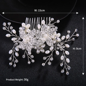 Detail of silver floral hair comb with pearls and rhinestones showing 15cm x 9cm dimensions