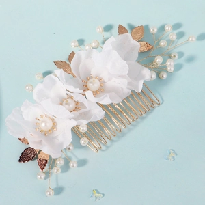 Handmade bridal hair comb with white fabric flowers and pearls on golden wire