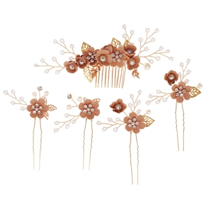 Pink fabric flower bridal hair comb set with white pearls and gold leaves on white background