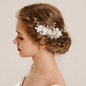 Exquisite bridal hair comb with silver metal leaves and white pearls for wedding hairstyle