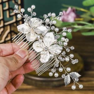 Handmade silver floral hair comb with pearls and crystals for elegant bridal hair styling