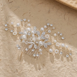 Handmade bridal hair comb with elegant white pearls and rhinestones on silver floral branches