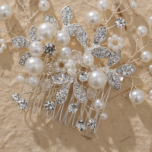 Silver bridal hair comb with handmade pearls and sparkling rhinestones for wedding