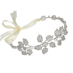 Detailed view of silver leaf tiara with clear rhinestones and white silk ribbons