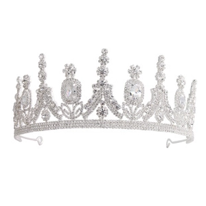 Detailed macro view of silver alloy crown featuring intricate rhinestone settings