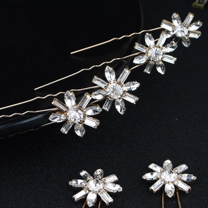 Elegant crystal flower hair pins set in gold finish for bridal and wedding styling