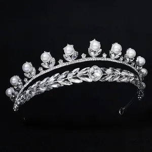 Detailed macro view of luxury silver floral headband with white pearls and crystals