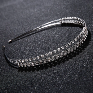 Macro detail of silver double-layer crystal headband with shiny rhinestones