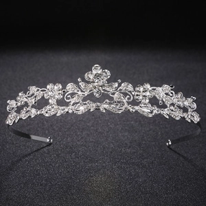 Macro shot of silver tiered rhinestone headband with intricate floral metal details