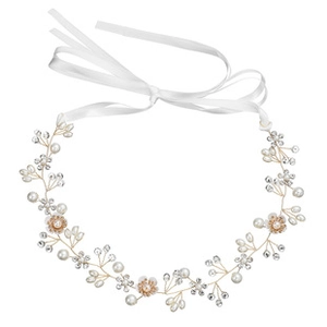 Detailed view of handmade bridal vine headband with white pearls, rhinestones and ribbon