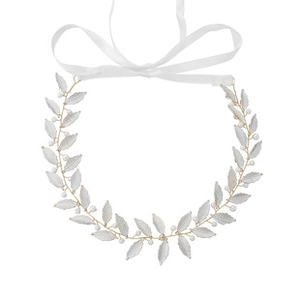Detail of floral bridal hairband with matte white leaves, pearls and long white ribbons